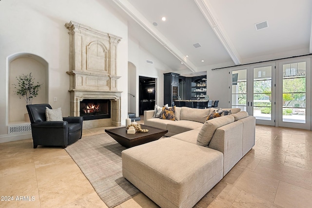 living room with beamed ceiling, french doors, high vaulted ceiling, and bar