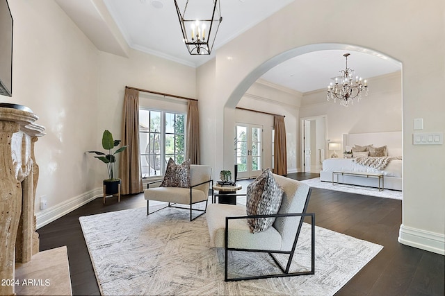 interior space featuring a chandelier, dark wood-type flooring, and ornamental molding