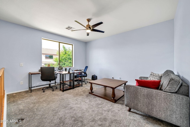 carpeted home office featuring ceiling fan and baseboards