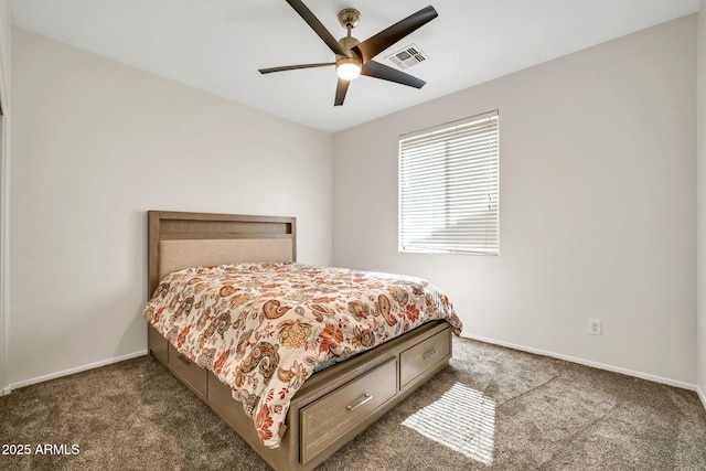 bedroom featuring dark colored carpet, baseboards, and a ceiling fan