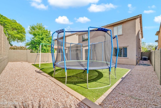 view of jungle gym featuring a trampoline and cooling unit