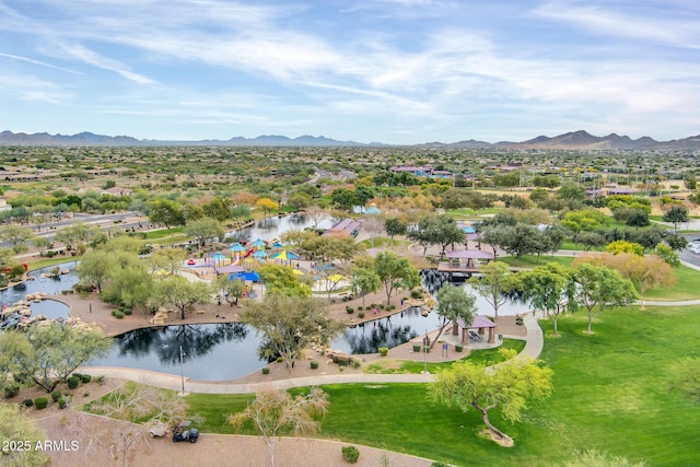 aerial view of property's location with a water and mountain view