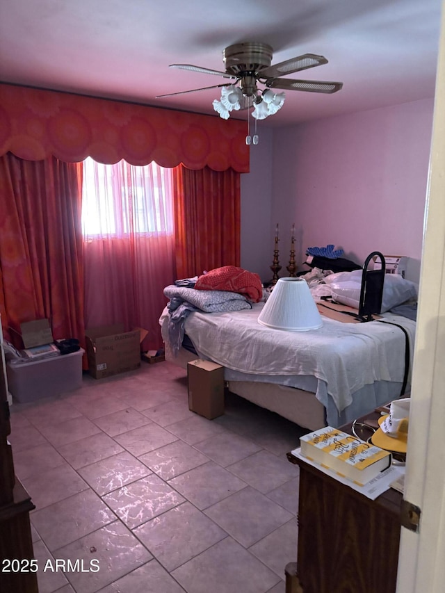 bedroom with tile patterned flooring and ceiling fan