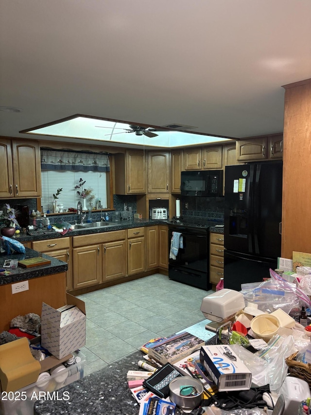 kitchen with black appliances, a sink, ceiling fan, light tile patterned floors, and tasteful backsplash