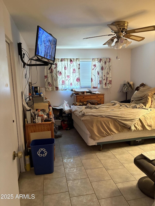 bedroom featuring tile patterned flooring and a ceiling fan