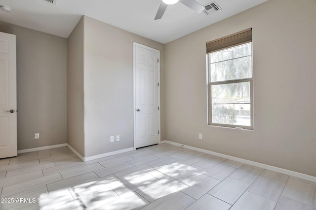 unfurnished room with ceiling fan