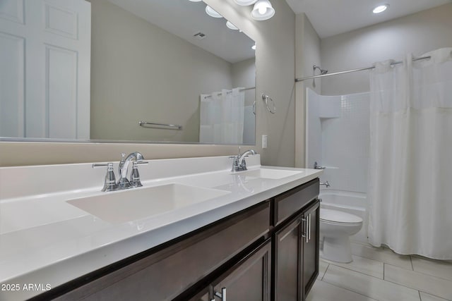 full bathroom with vanity, tile patterned floors, toilet, and shower / bath combo with shower curtain