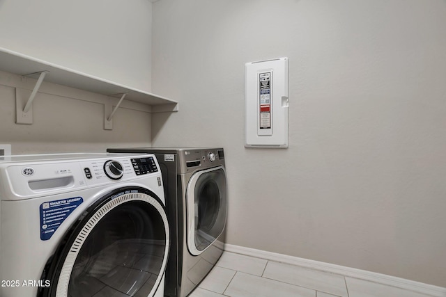 laundry room with light tile patterned floors and independent washer and dryer