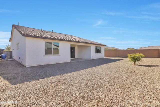 rear view of house with a patio