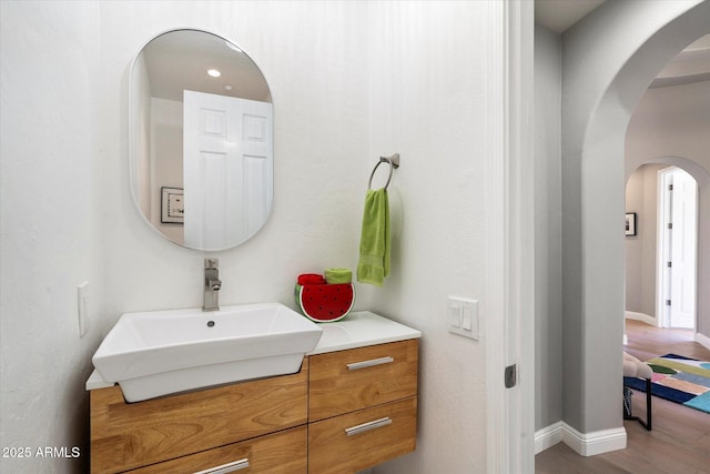 bathroom with vanity and hardwood / wood-style flooring