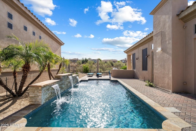 view of pool with pool water feature