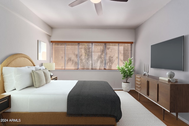 bedroom with hardwood / wood-style flooring and ceiling fan