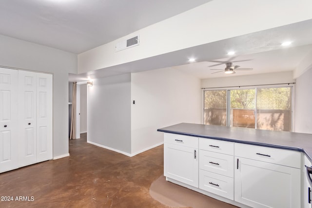 kitchen featuring white cabinets and ceiling fan