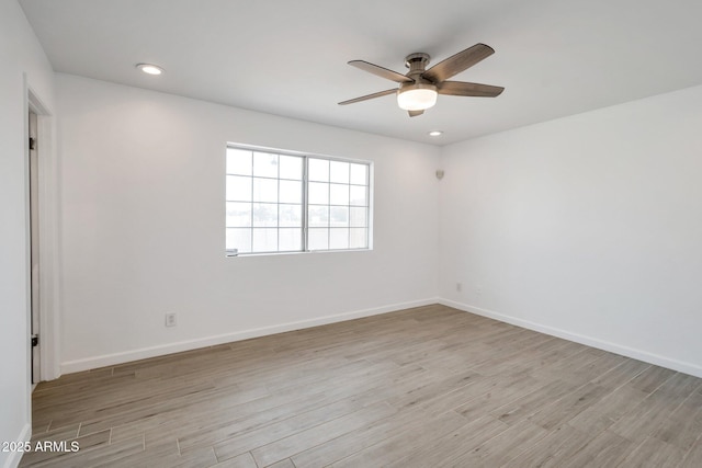 unfurnished room with light hardwood / wood-style flooring and ceiling fan