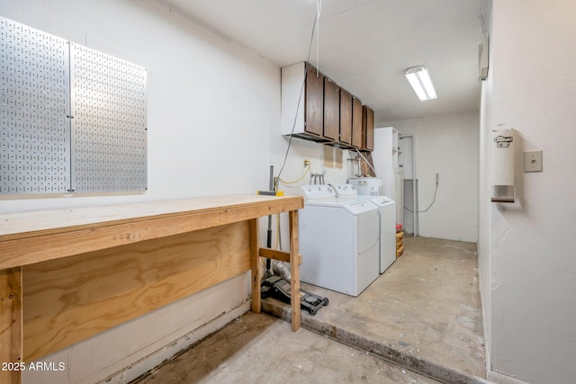 laundry room with cabinets and washing machine and clothes dryer