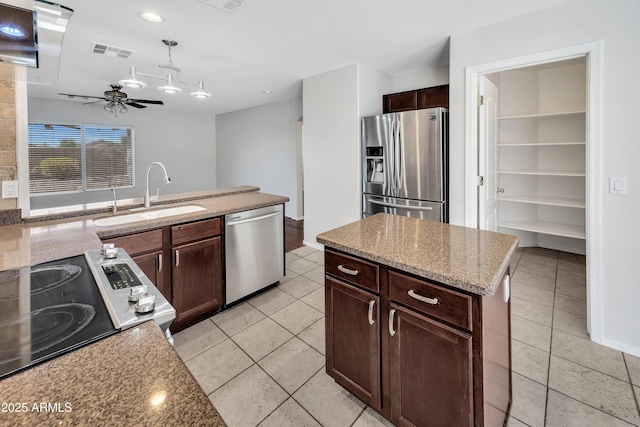 23075 W Arrow Dr, Buckeye, AZ 85326 - kitchen featuring stainless steel appliances, a ceiling fan, light tile patterned floors, pendant lighting, and recessed lighting