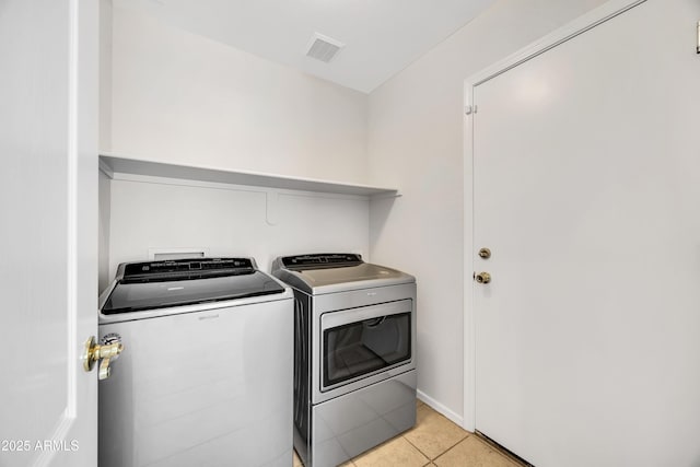 23075 W Arrow Dr, Buckeye, AZ 85326 - laundry room with separate washer and dryer and light tile patterned floors