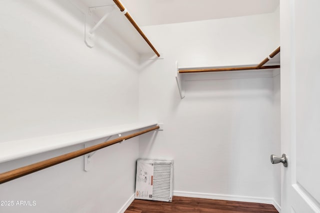 23075 W Arrow Dr, Buckeye, AZ 85326 - spacious closet featuring dark wood-type flooring