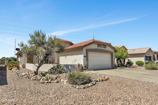 23075 W Arrow Dr, Buckeye, AZ 85326 - view of front of property featuring stucco siding, a tile roof, concrete driveway, and an attached garage
