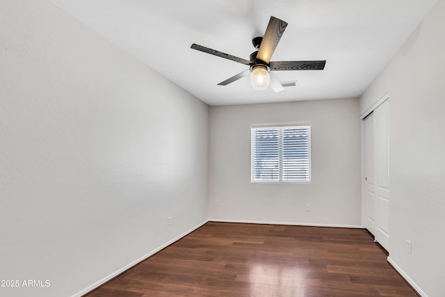 23075 W Arrow Dr, Buckeye, AZ 85326 - unfurnished bedroom featuring wood finished floors, a closet, and a ceiling fan