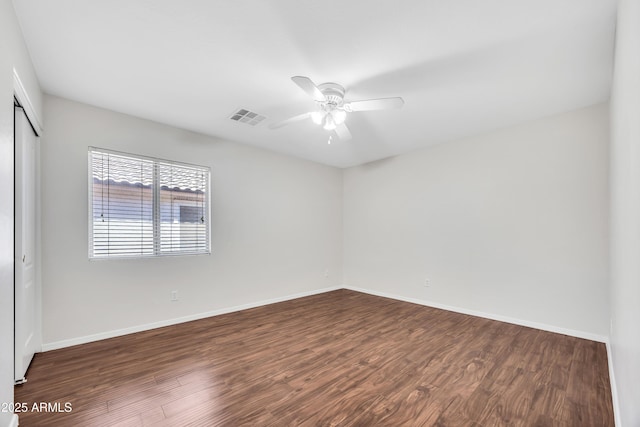 23075 W Arrow Dr, Buckeye, AZ 85326 - spare room with a ceiling fan and dark wood-style flooring