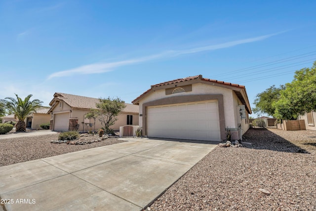 23075 W Arrow Dr, Buckeye, AZ 85326 - mediterranean / spanish house featuring stucco siding, a tile roof, concrete driveway, and a garage
