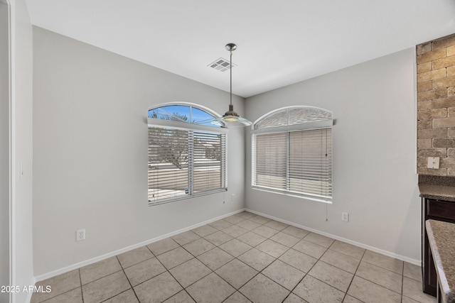 23075 W Arrow Dr, Buckeye, AZ 85326 - unfurnished dining area featuring light tile patterned flooring and a ceiling fan