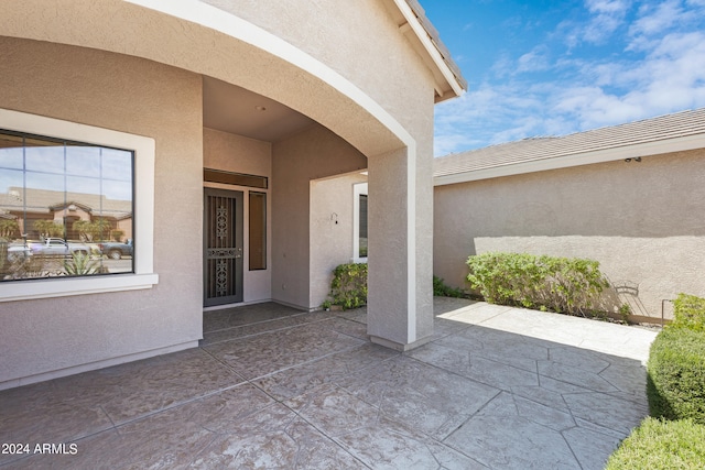 doorway to property with a patio area