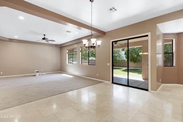 carpeted spare room with beamed ceiling and ceiling fan with notable chandelier