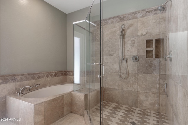 bathroom with tile patterned flooring and plus walk in shower