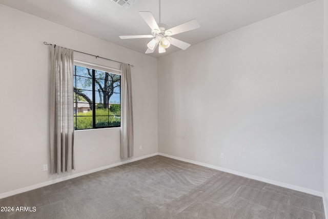 carpeted empty room with ceiling fan