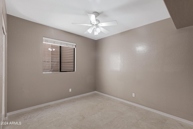 unfurnished room with ceiling fan