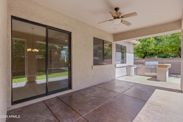 view of patio with ceiling fan and area for grilling