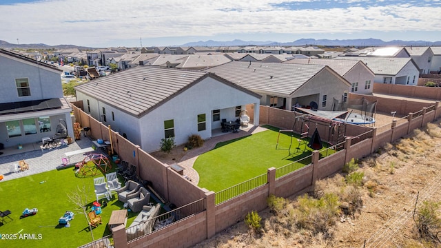 birds eye view of property with a residential view and a mountain view