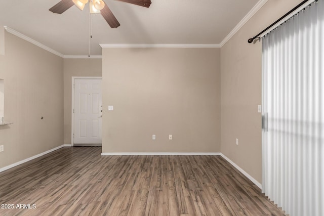 unfurnished room with ornamental molding, wood finished floors, a ceiling fan, and baseboards