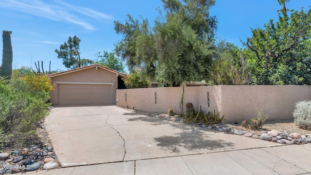 7806 N Via Del Sol, Scottsdale, AZ 85258 - view of home's exterior featuring stucco siding, concrete driveway, and an attached garage