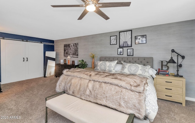 7806 N Via Del Sol, Scottsdale, AZ 85258 - bedroom with light carpet, a barn door, and ceiling fan