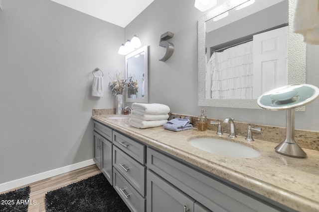 7806 N Via Del Sol, Scottsdale, AZ 85258 - full bath with wood finished floors and double vanity