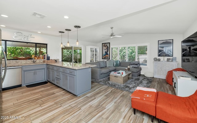 7806 N Via Del Sol, Scottsdale, AZ 85258 - kitchen with gray cabinets, stainless steel dishwasher, a peninsula, open floor plan, and light wood-type flooring