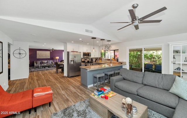 7806 N Via Del Sol, Scottsdale, AZ 85258 - living area with lofted ceiling, light wood-style flooring, and a ceiling fan