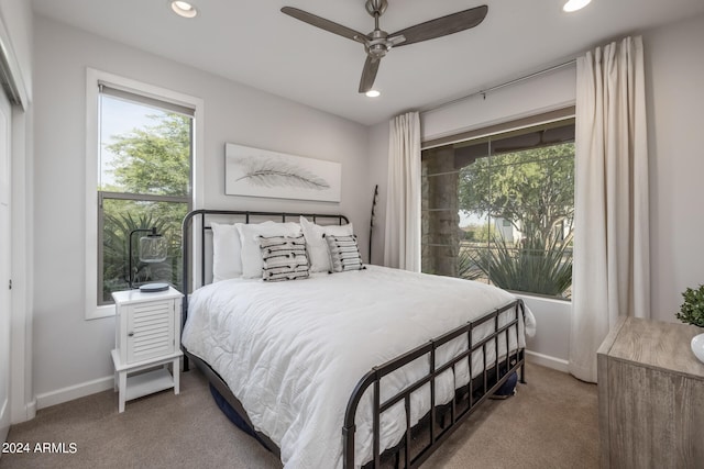 carpeted bedroom featuring ceiling fan