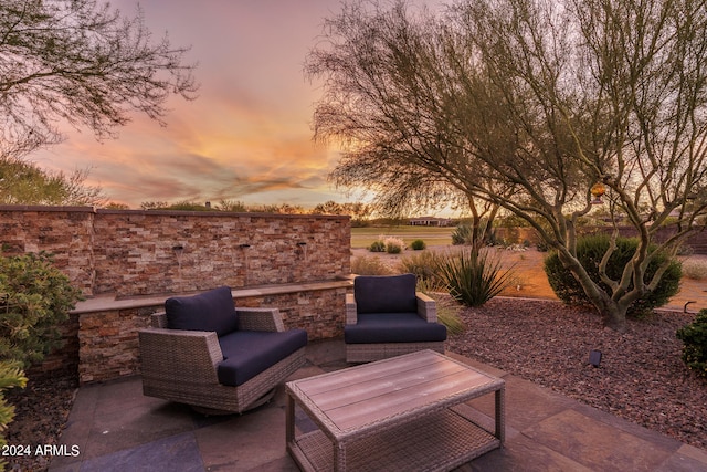 view of patio terrace at dusk