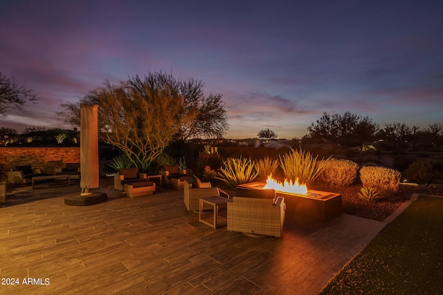 patio terrace at dusk with a fire pit