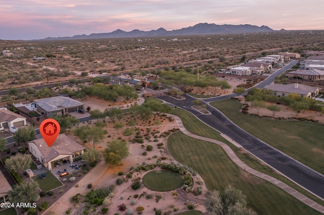 aerial view at dusk with a mountain view