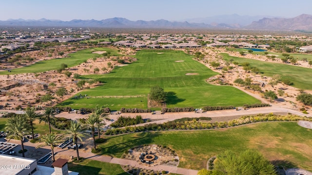 birds eye view of property with a mountain view