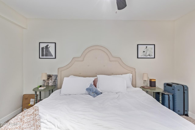 bedroom with ceiling fan and carpet flooring