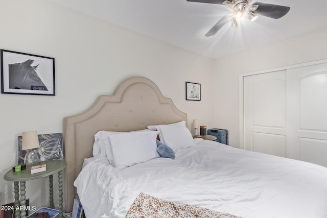 bedroom with ceiling fan and a closet