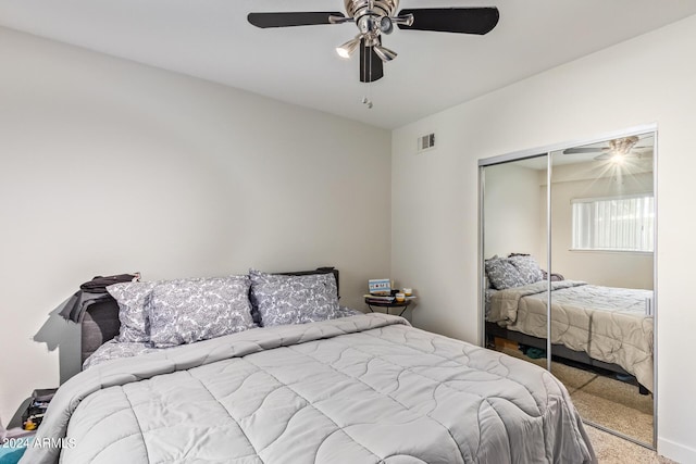 bedroom with carpet flooring, a closet, and ceiling fan