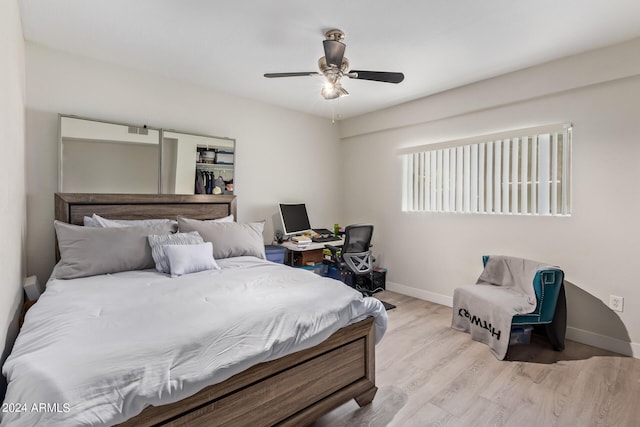 bedroom featuring ceiling fan and light hardwood / wood-style flooring