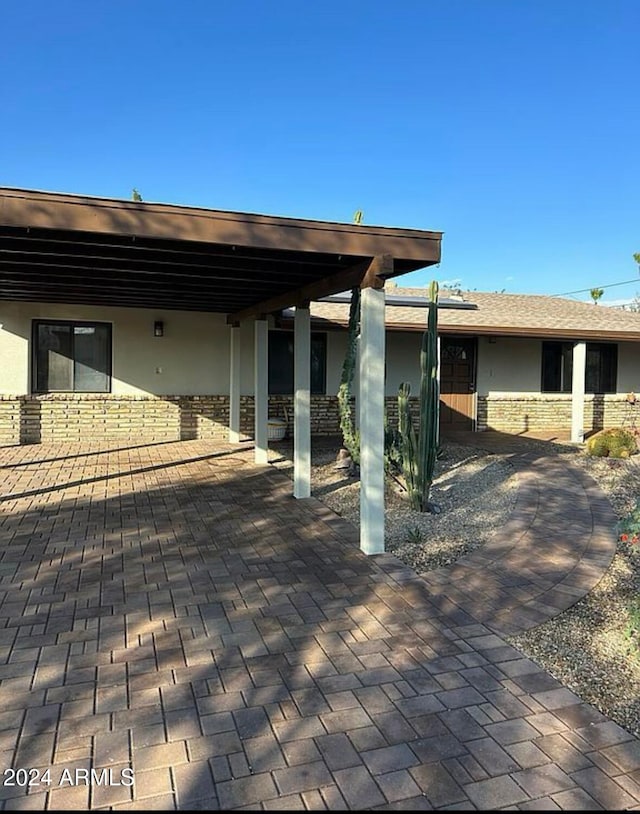 view of patio / terrace with a carport